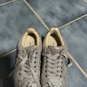 The shoes are worn and small defect on the left